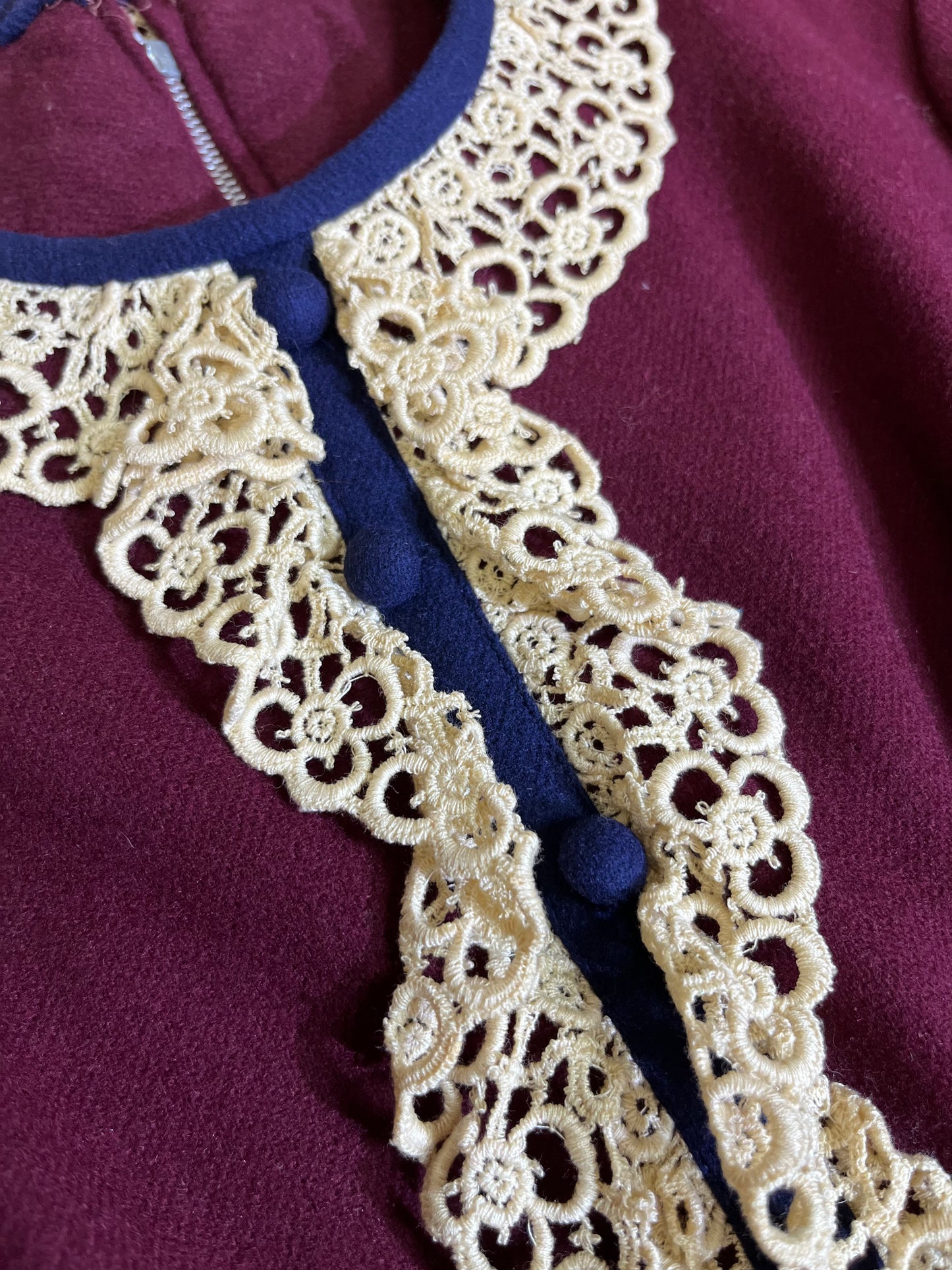 Close-up of the delicate lace collar on the Maroon Meadows Vintage Prairie Dress, adding a touch of romantic femininity.