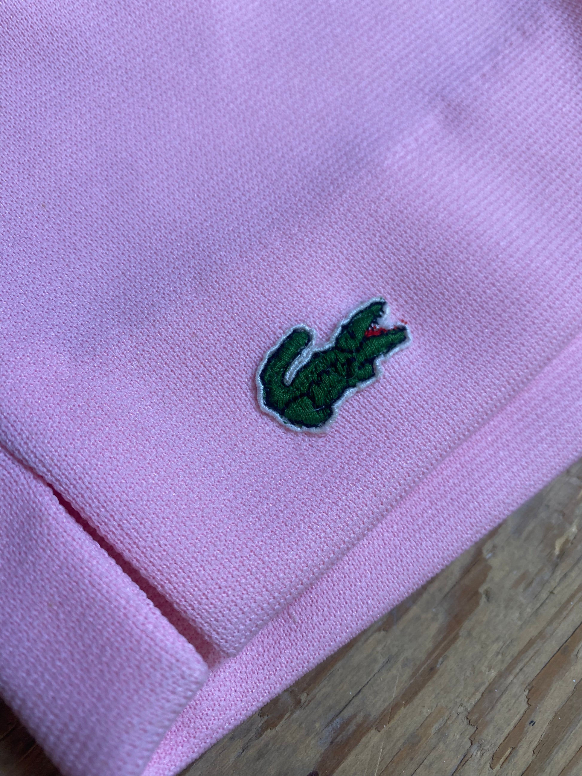  "Close-up view of the distinctive patch on the right thigh of Vintage High-Waisted Pink Shorts by Haymaker Lacoste, adding a touch of individuality to the design."